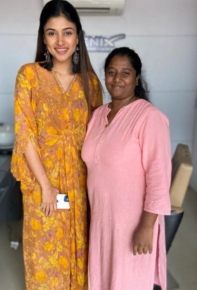 Inside Phoenix Family Salon in Erode, with a client and a member of the team