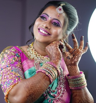 Bride in full bridal makeup with mehendi and traditional jewellery