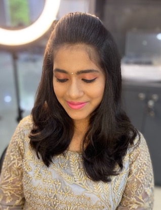 Party makeup and soft blow-dry styling