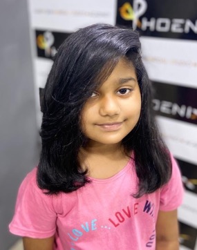 A young girl after a haircut and blow-dry